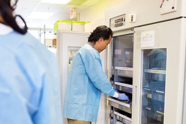 Researcher Retrieving Samples from Storage