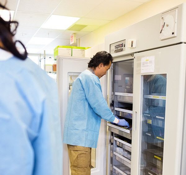 Researcher Retrieving Samples from Storage