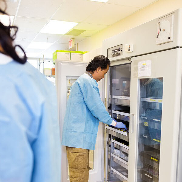 Researcher Retrieving Samples from Storage