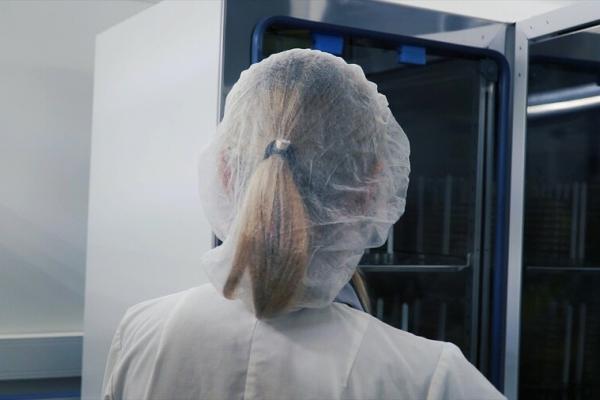 Researcher taking test tubes from a fridge