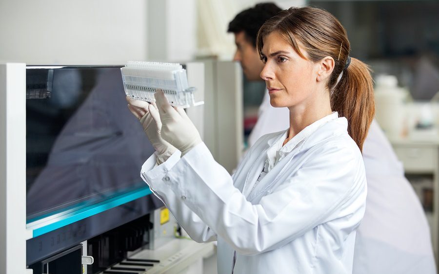 Researcher analysing samples in laboratory