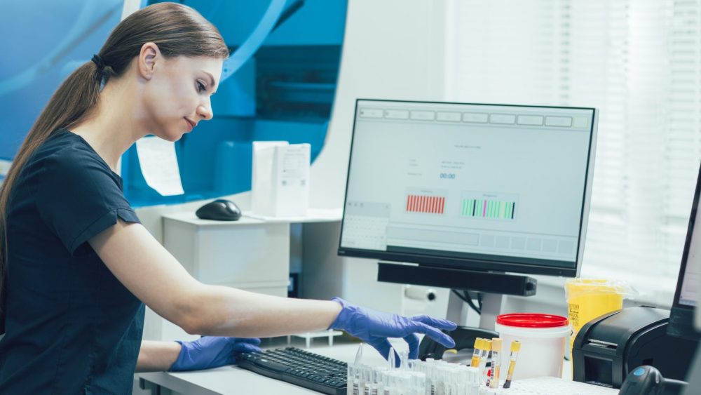 Technician Scanning Samples