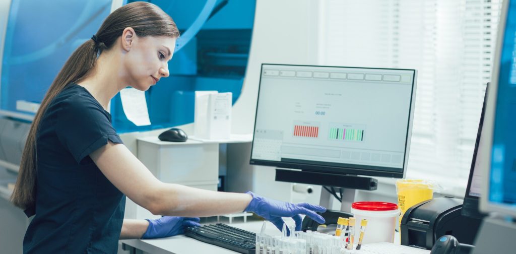 Technician Scanning Samples