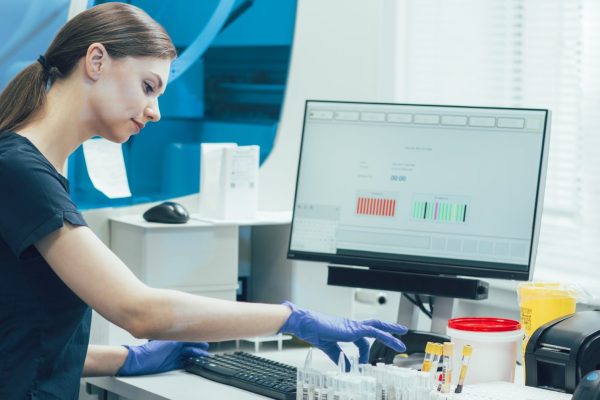 Technician Scanning Samples